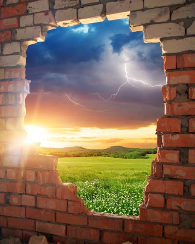 View of Storm Through Hole in Brick Wall