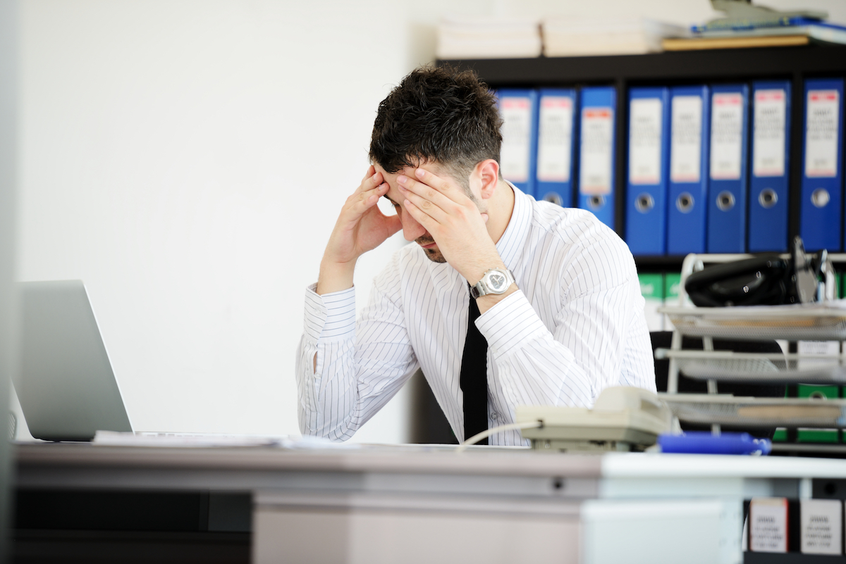 Guy Stress Out at Desk